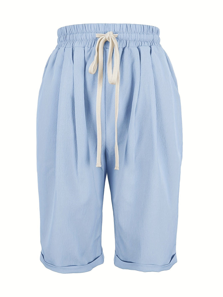 Side view of gray capri pants showing soft flowing fabric and relaxed silhouette