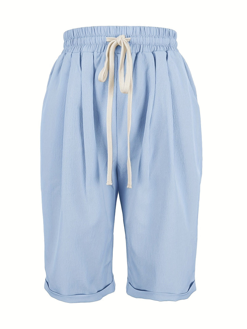 Side view of gray capri pants showing soft flowing fabric and relaxed silhouette