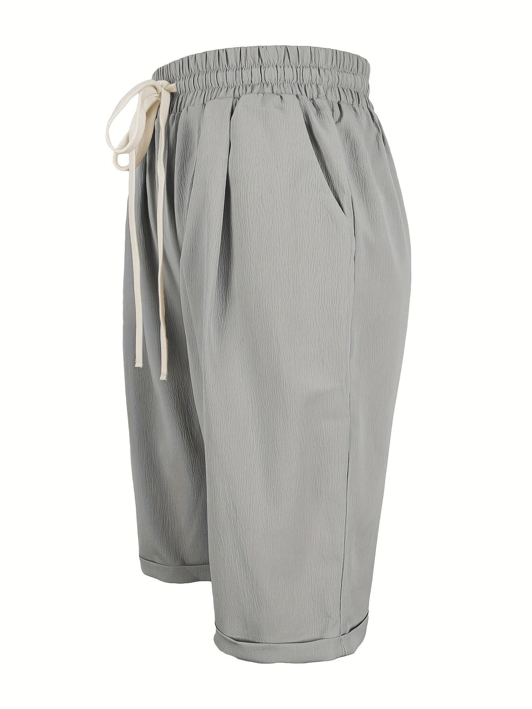 Detail shot of lightweight breathable fabric on relaxed capri pants
