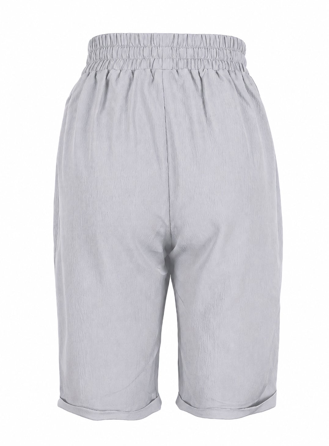 Relaxed capri pants in gray styled with strappy sandals for a summer look