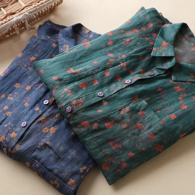 Close-up of the floral print and collar on a lightweight women's button-up shirt in green