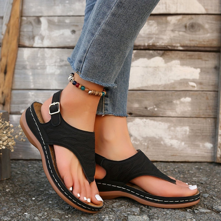 Annette sandal in brown with minimalist strap design, top-down view