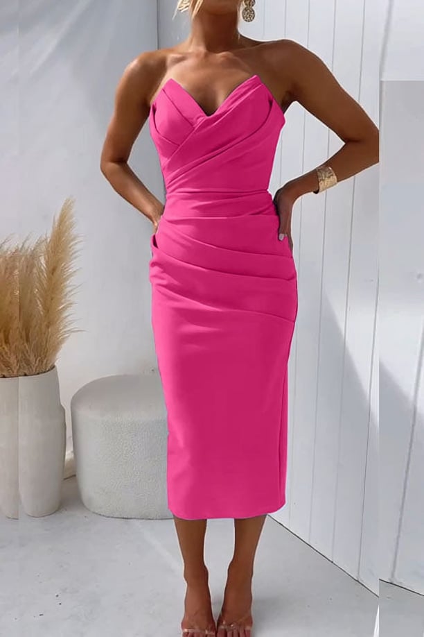 Antoinette dress in hot pink styled with heeled sandals and a clutch