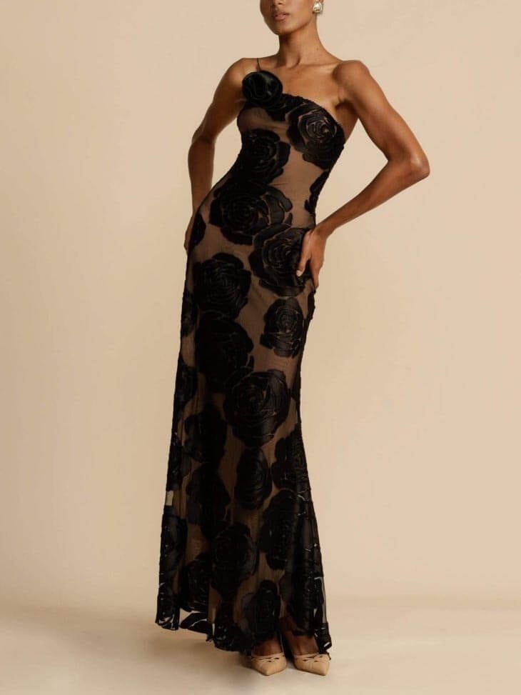 Close-up of the Arabella maxi dress showing delicate floral print on lightweight black fabric