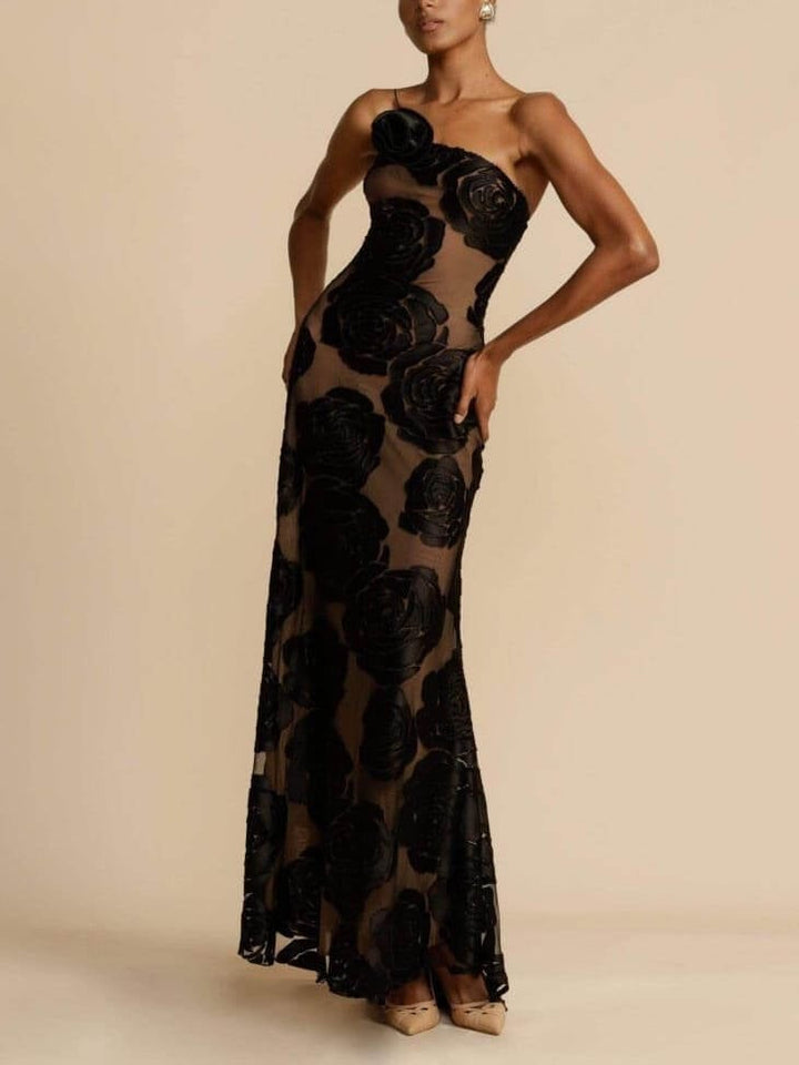Close-up of the Arabella maxi dress showing delicate floral print on lightweight black fabric