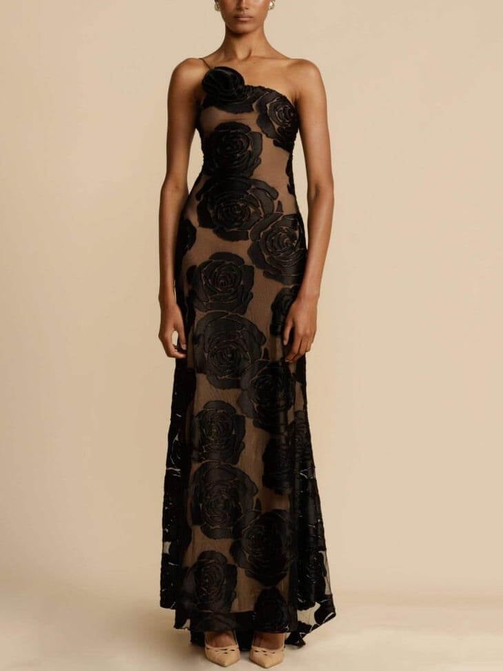 Woman in the Arabella floral maxi dress styled for a wedding guest occasion with accessories