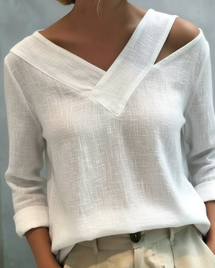 Aria asymmetric V-neck long sleeve top in white with draped shoulder strap detail, front view