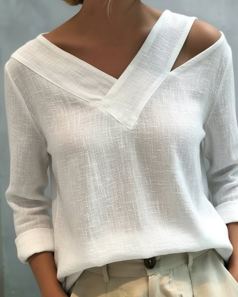 Aria asymmetric V-neck long sleeve top in white with draped shoulder strap detail, front view