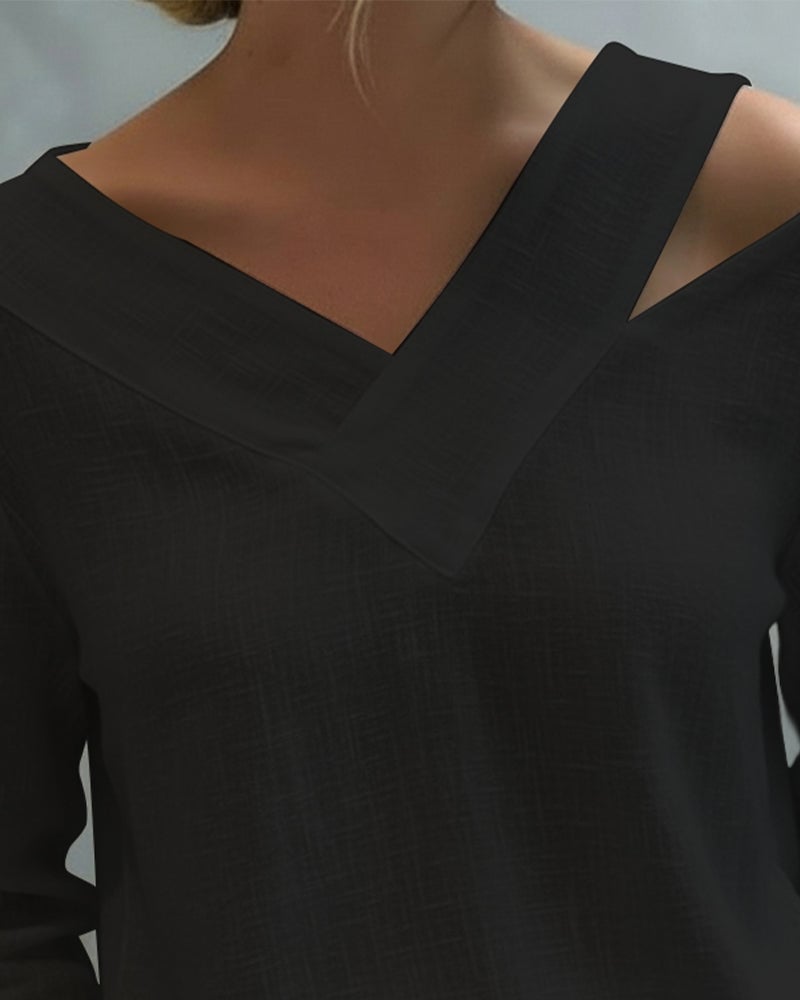 Aria long sleeve top in black with asymmetric V-neckline, front view