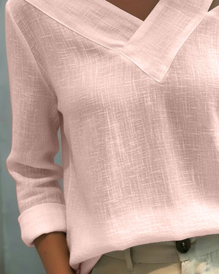 Aria top in pink with rolled cuff detail and flowing fit, three-quarter view