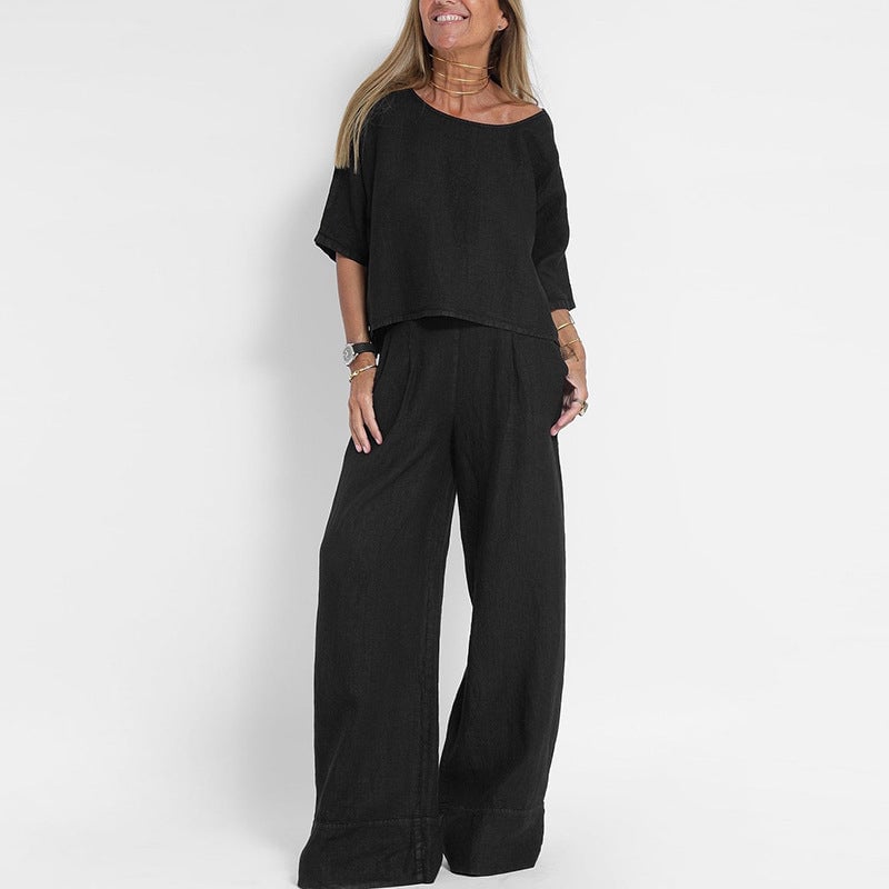 Model styling the Arianah two-piece set in black, demonstrating the flattering loose fit from the front