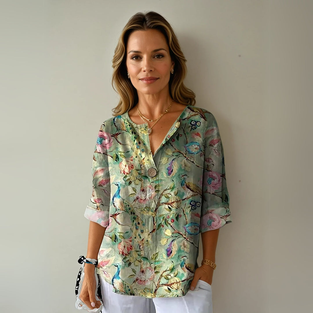 Close-up detail of the soft breathable fabric and graceful floral print on the Arlene blouse