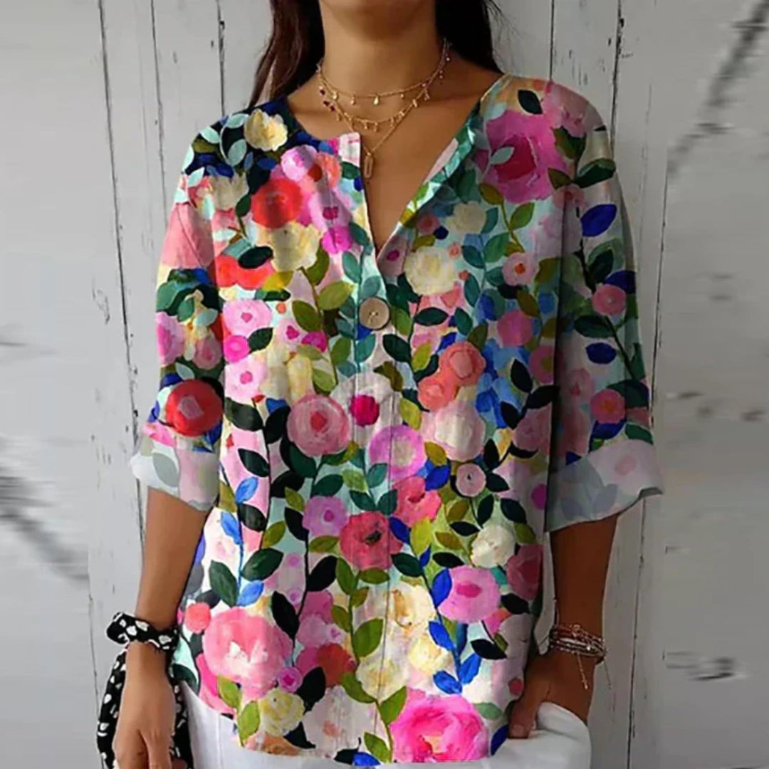 Arlene floral blouse in red and blue-pink color option laid flat showing full print detail