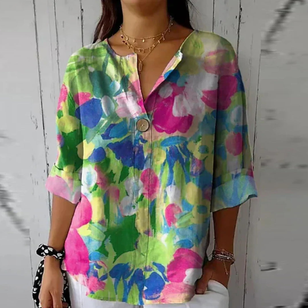 Multiple color options of the Arlene floral print blouse displayed side by side