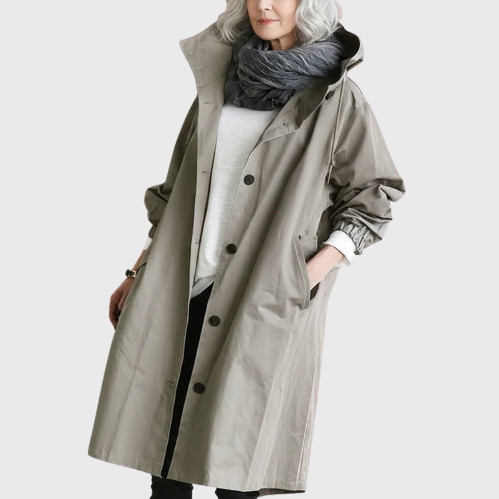 Front view of the Arline waterproof trench coat in grey with adjustable belt and classic lapels