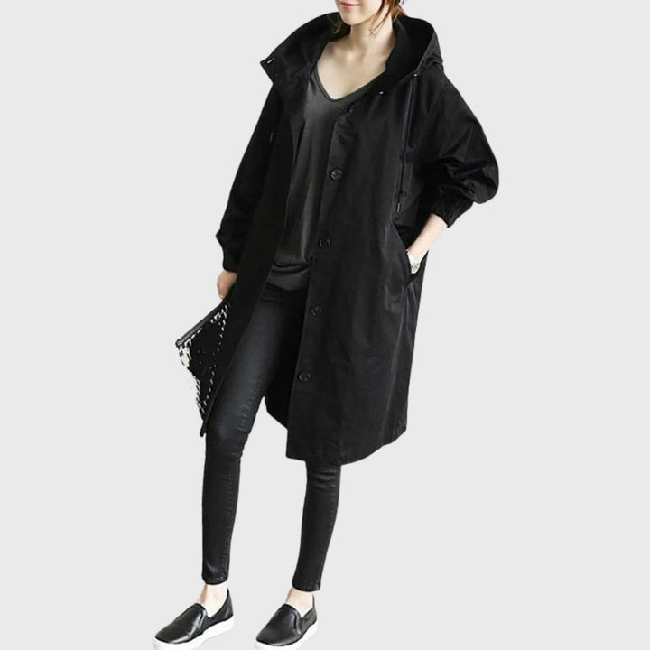 Back view of the Arline waterproof trench coat showing streamlined silhouette and length
