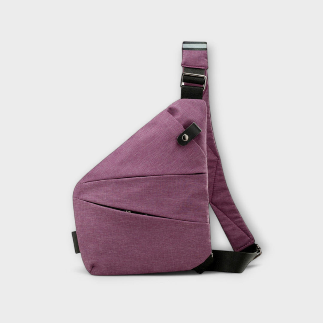 Close-up of crossbody bag zipper and hardware detail in gray colorway