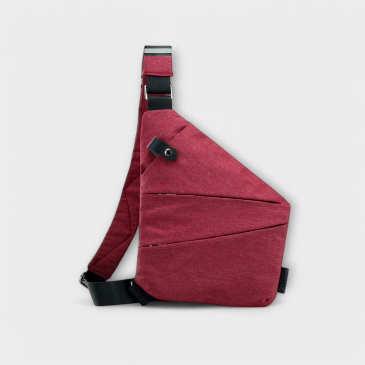 Detail shot of crossbody bag exterior pocket in Purple colorway