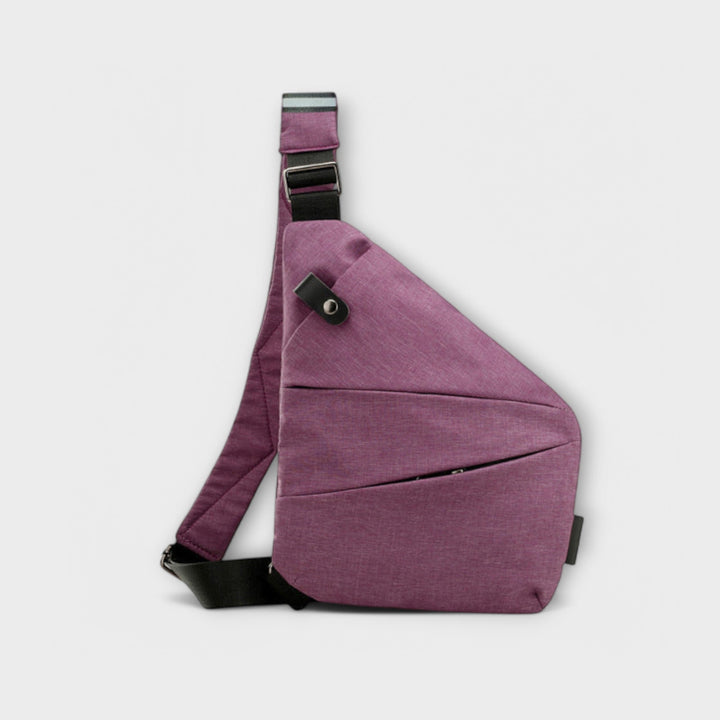 Crossbody bag in Navy Blue shown from the back highlighting secure main compartment