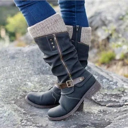 Women's ankle boots with side zipper in black, shown from a front three-quarter angle highlighting the sleek silhouette