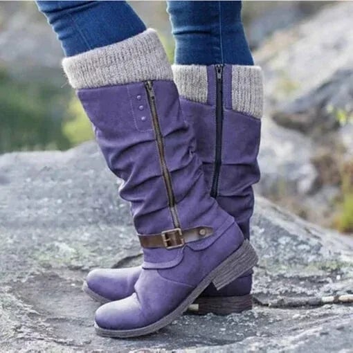Close-up of the side zipper detail on women's ankle boots in black
