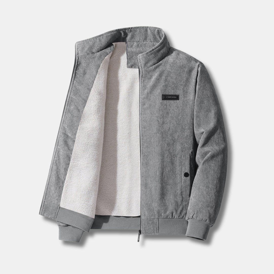 Front view of a sherpa-lined corduroy jacket in a neutral tone, featuring zip closure and ribbed cuffs