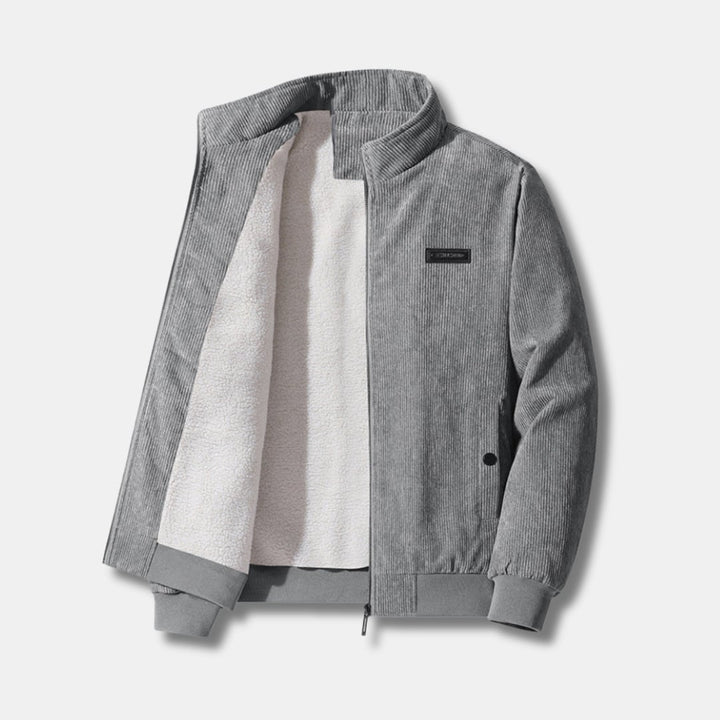 Front view of a sherpa-lined corduroy jacket in a neutral tone, featuring zip closure and ribbed cuffs