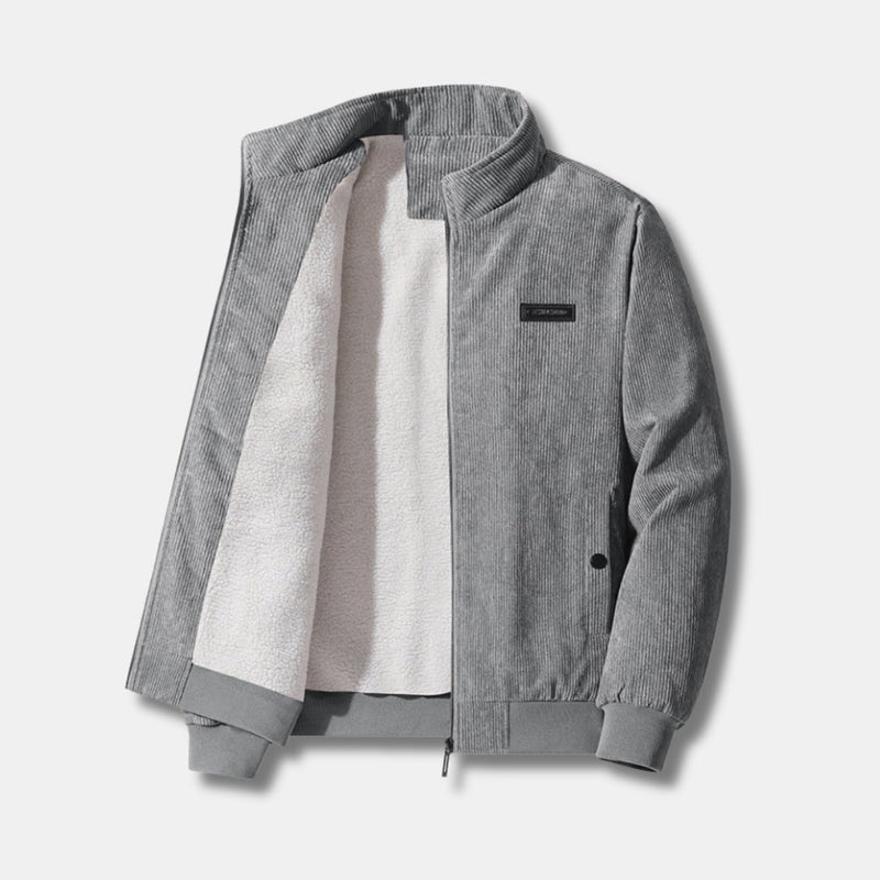 Front view of a sherpa-lined corduroy jacket in a neutral tone, featuring zip closure and ribbed cuffs