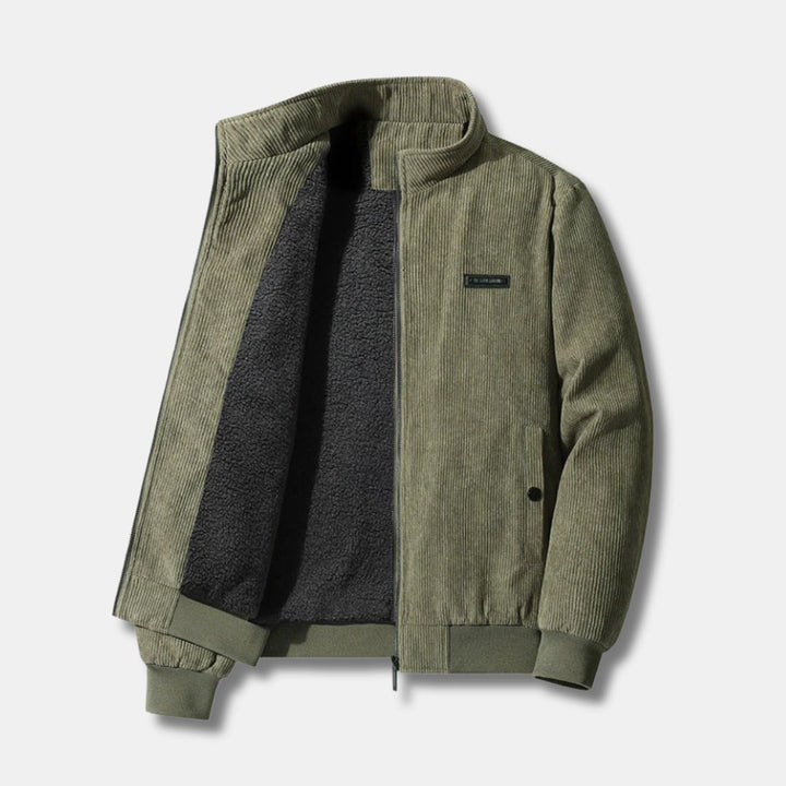 Close-up detail of the plush sherpa lining and buttoned pocket on the corduroy jacket