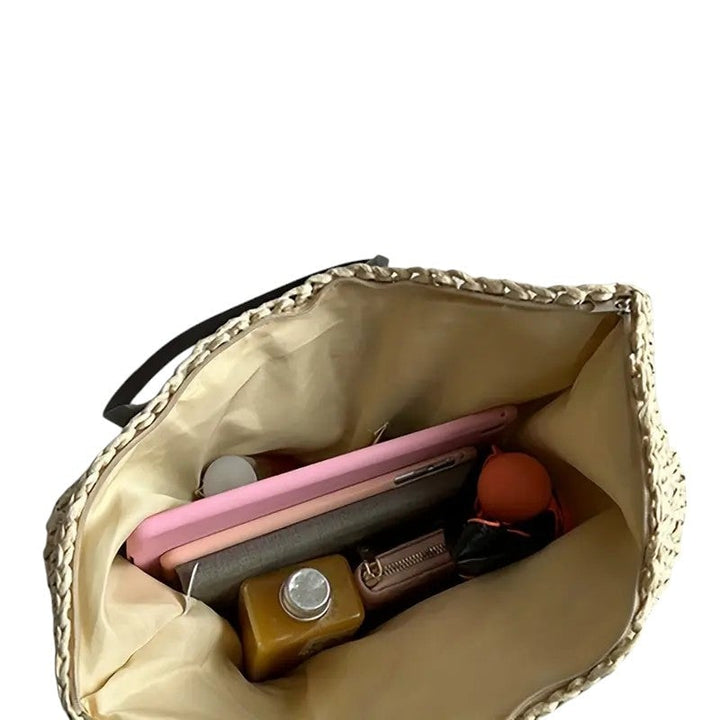 Model carrying the spacious beach tote bag over one shoulder in an outdoor setting