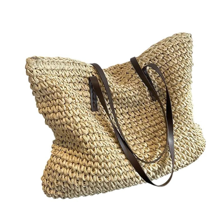 Detail shot of the natural woven texture and neutral color of the beach tote bag