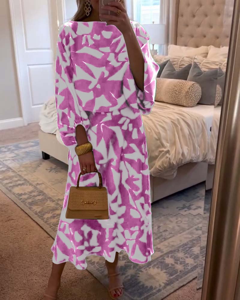 Model wearing blue two-piece printed set with lantern sleeves, full-length front view