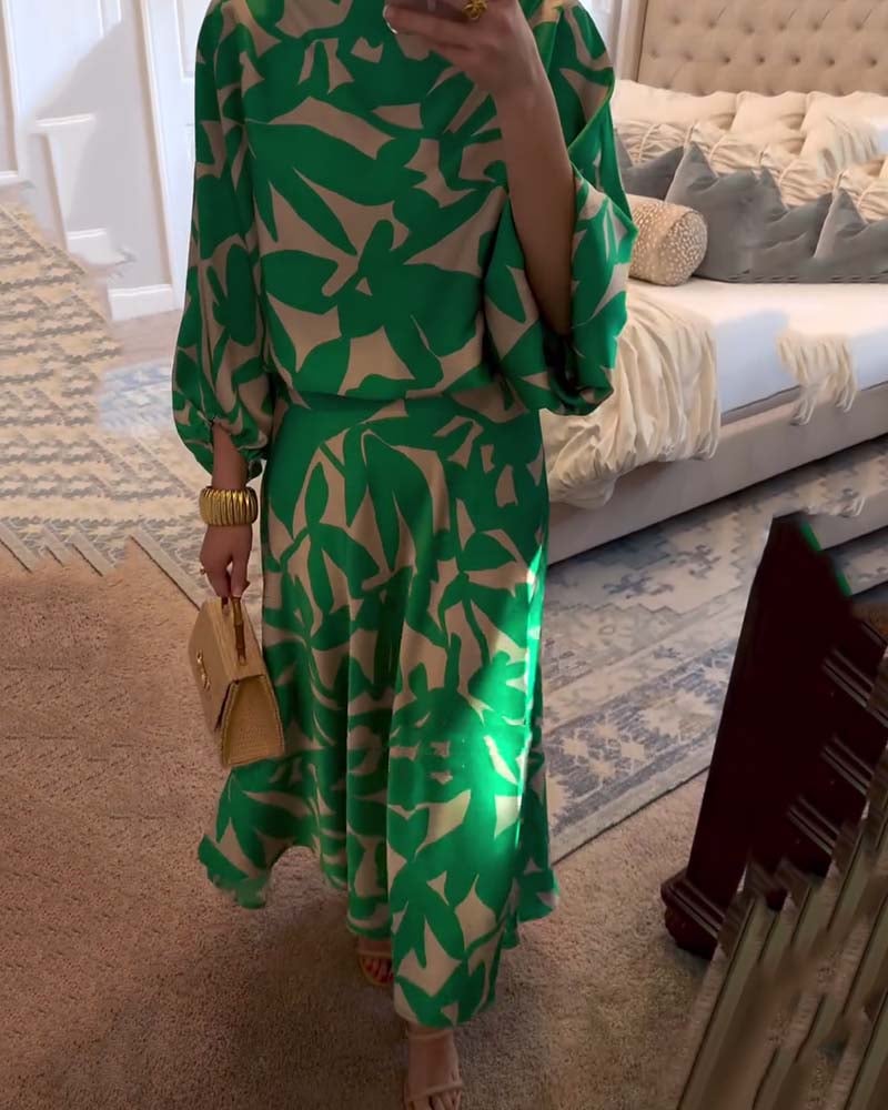 Model posing in green printed skirt and top set outdoors