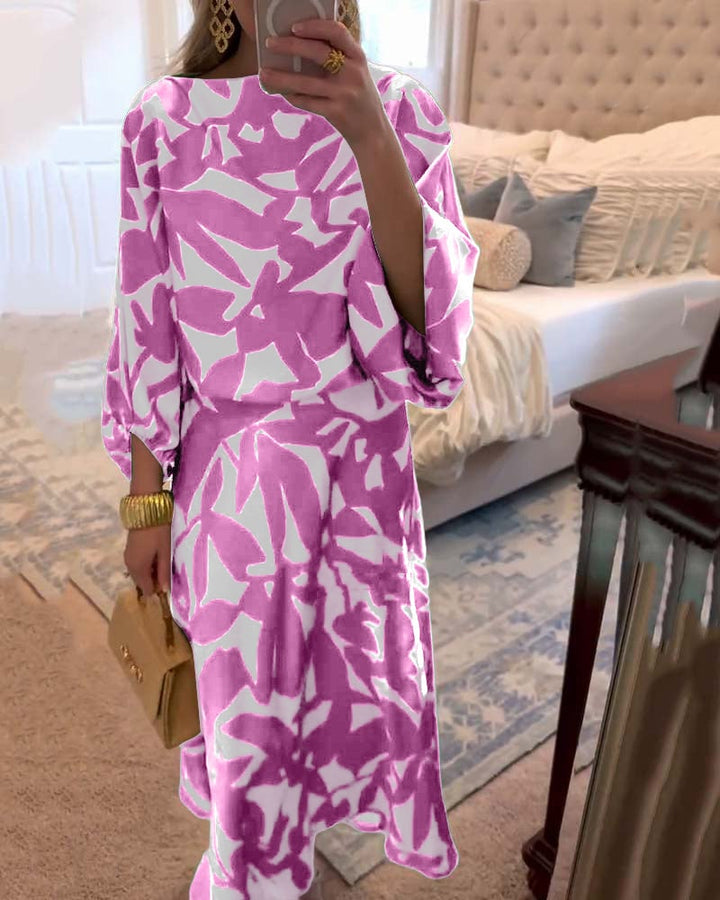 Blue two-piece printed set shown on model, three-quarter view