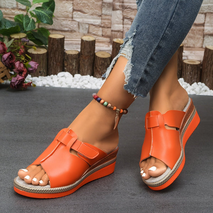 Aster women's sandals in orange, front three-quarter angle