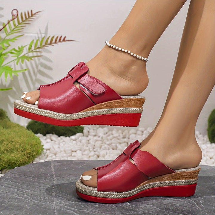 Close-up of Aster sandal cushioned insole and strap detail in magenta