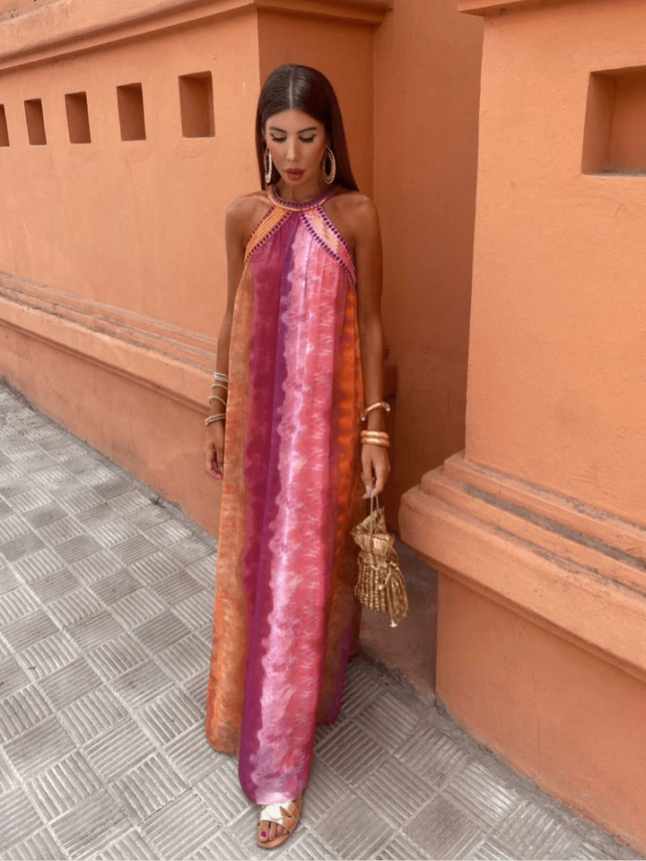 Model styled in the Aster multicolor ombre dress with sandals for a summer occasion look