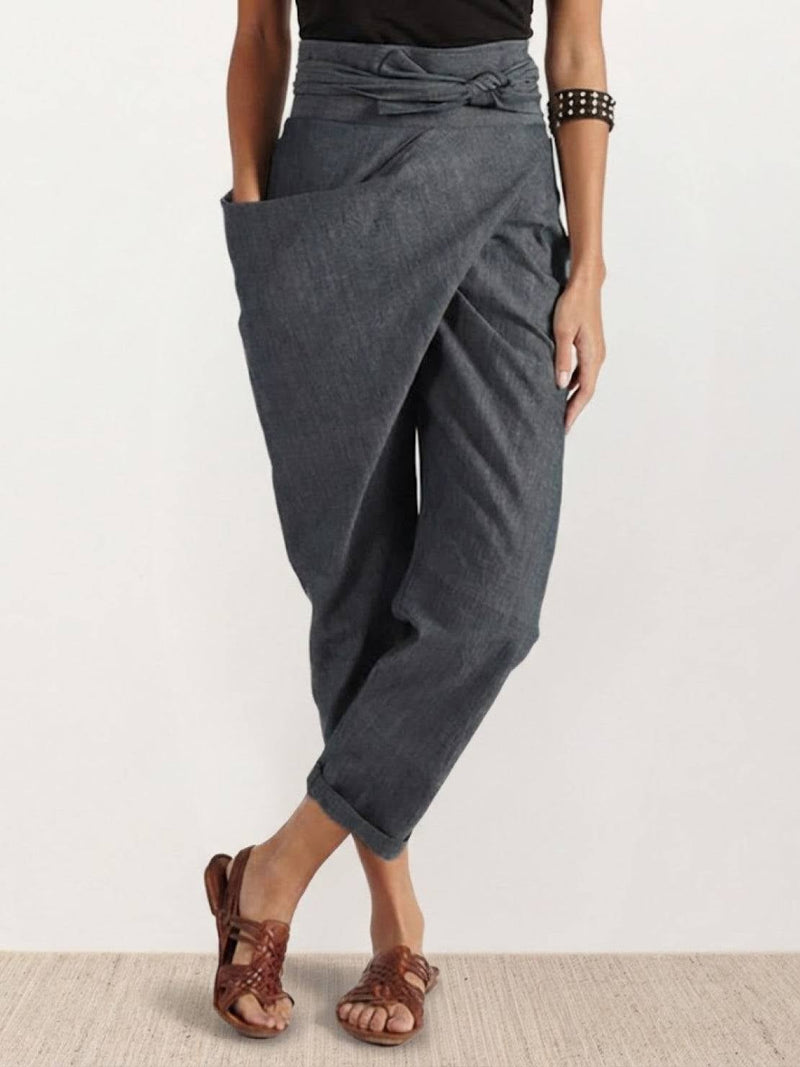 Front view of high waist wrap front cropped tapered pants in gray with self-tie bow waistband