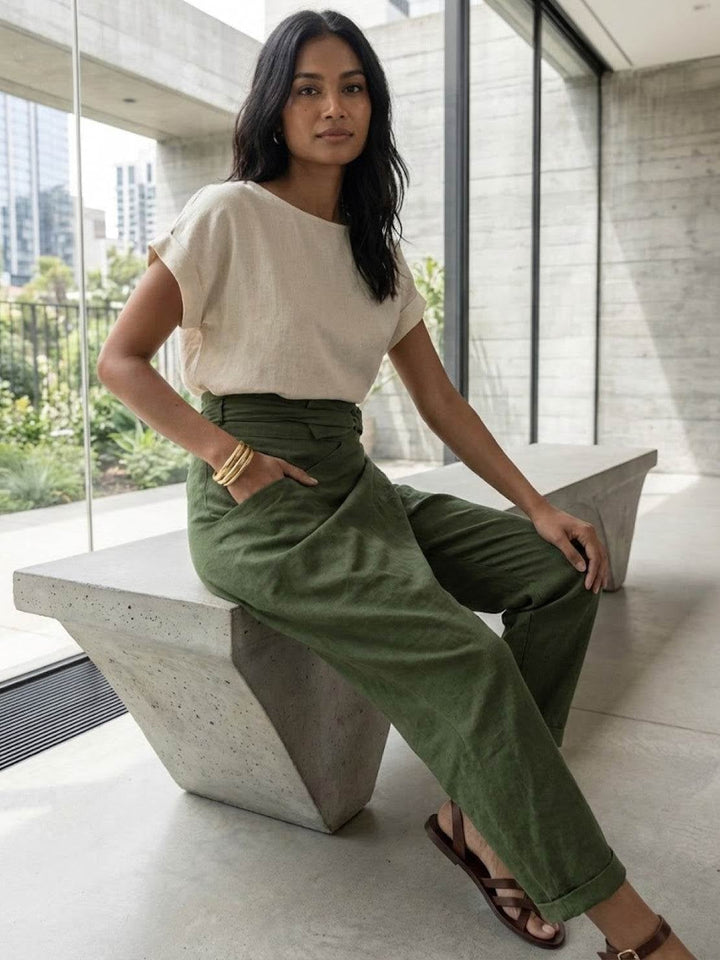 Close-up of crossover wrap panel and bow waistband on army green pants