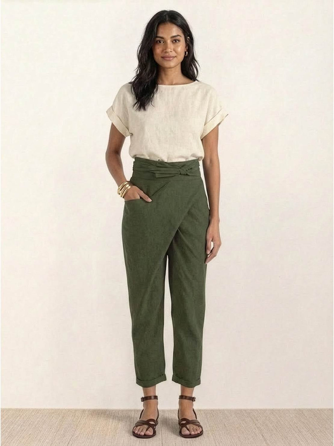 Model styling army green wrap front pants with sandals