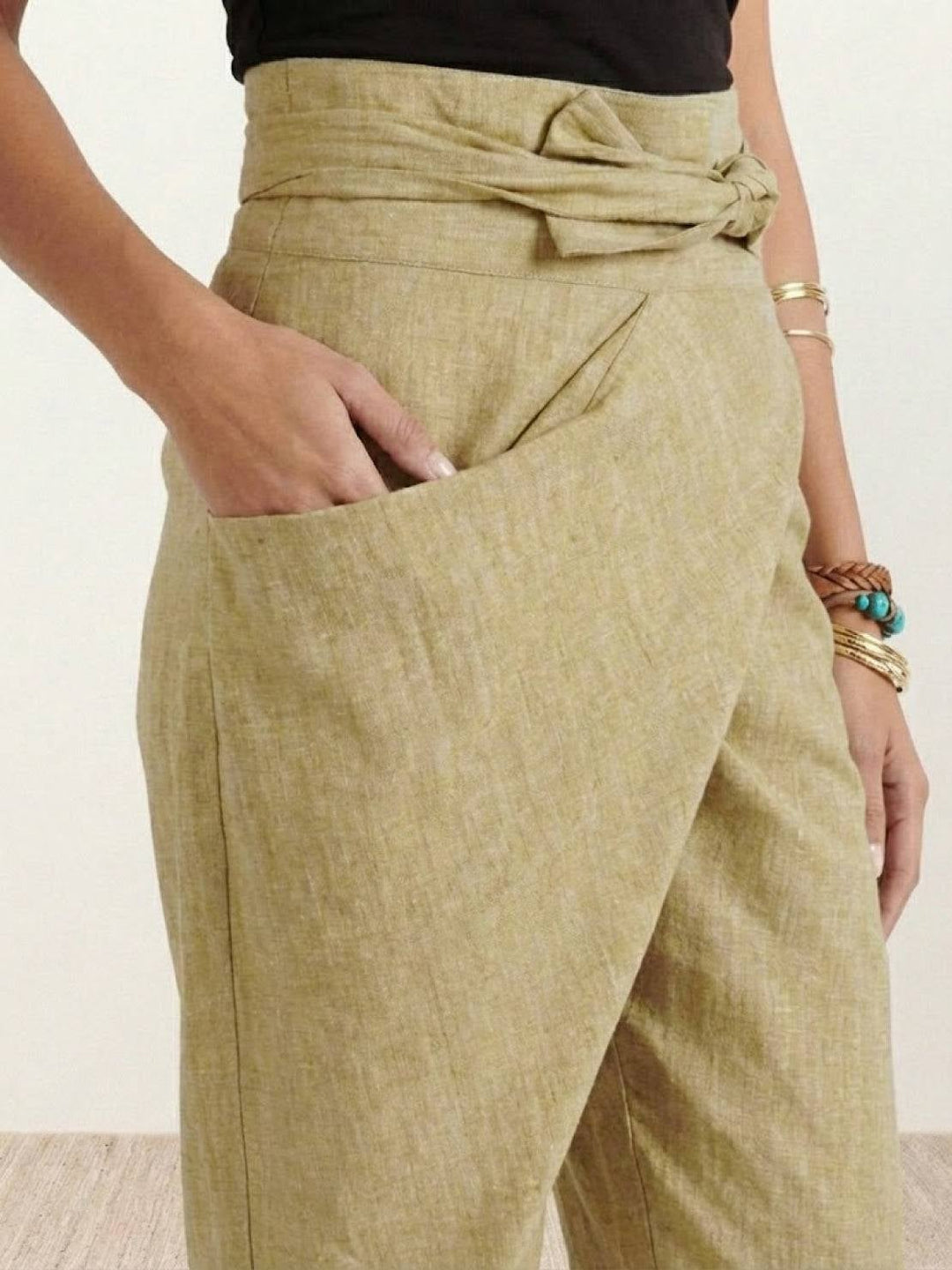 Back view of khaki high waist tapered cropped pants