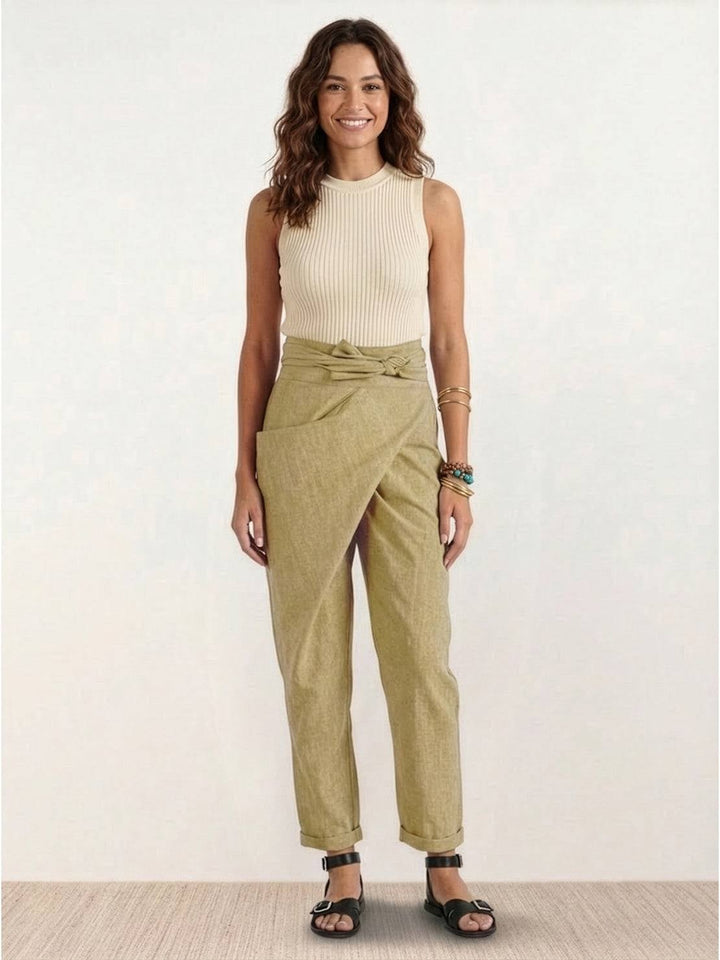 Model pairing khaki wrap front pants with espadrilles