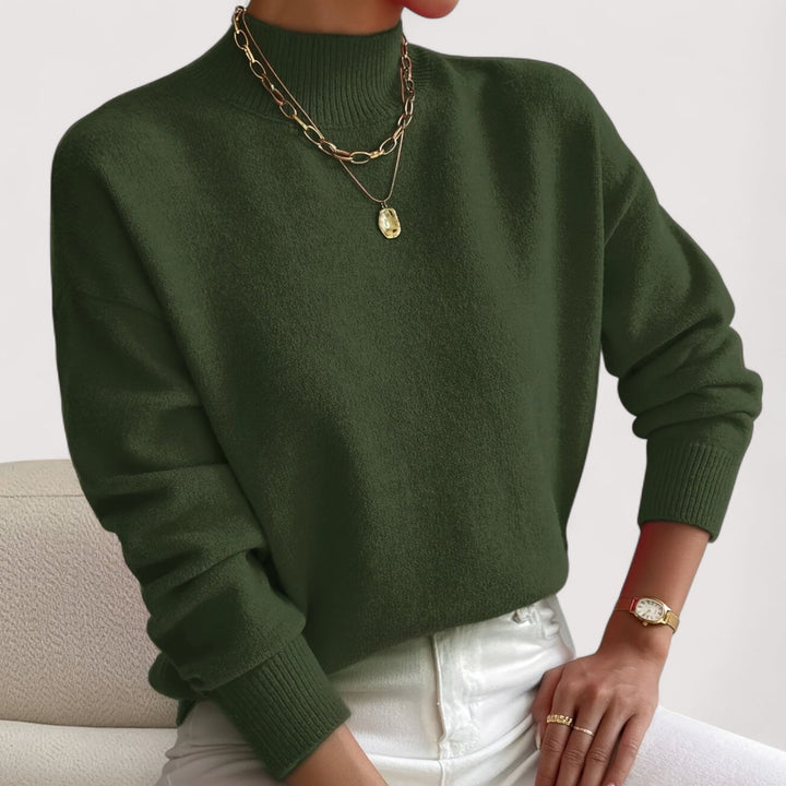 Green turtleneck sweater laid flat showing overall shape and length