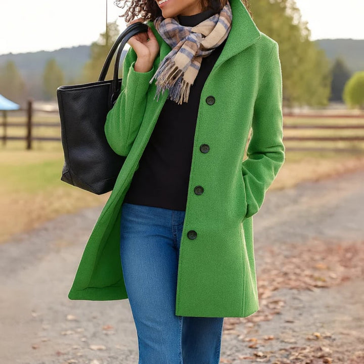Side profile of the Aubrey classic coat highlighting the clean silhouette and sleeve length