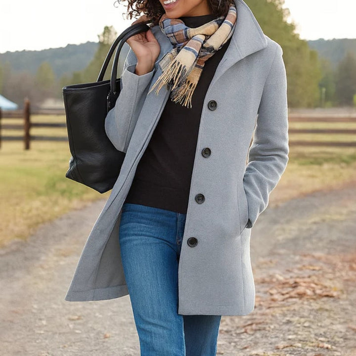Detail shot of the Aubrey coat fabric and button hardware