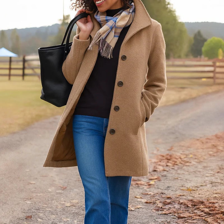 Model wearing the Aubrey coat in a bold color option showing versatile styling