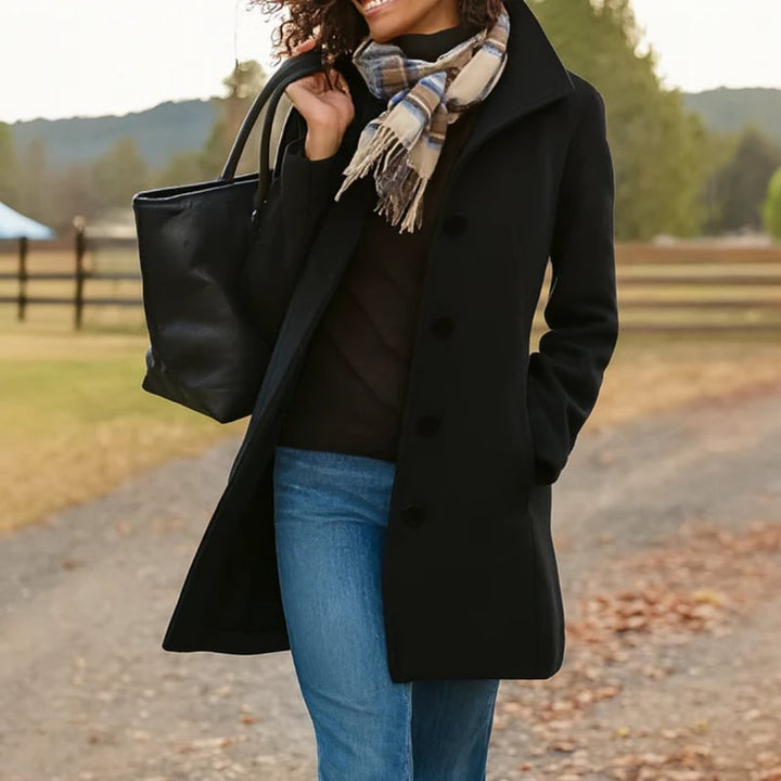 Flat lay of the Aubrey button-front coat showing overall shape and design details