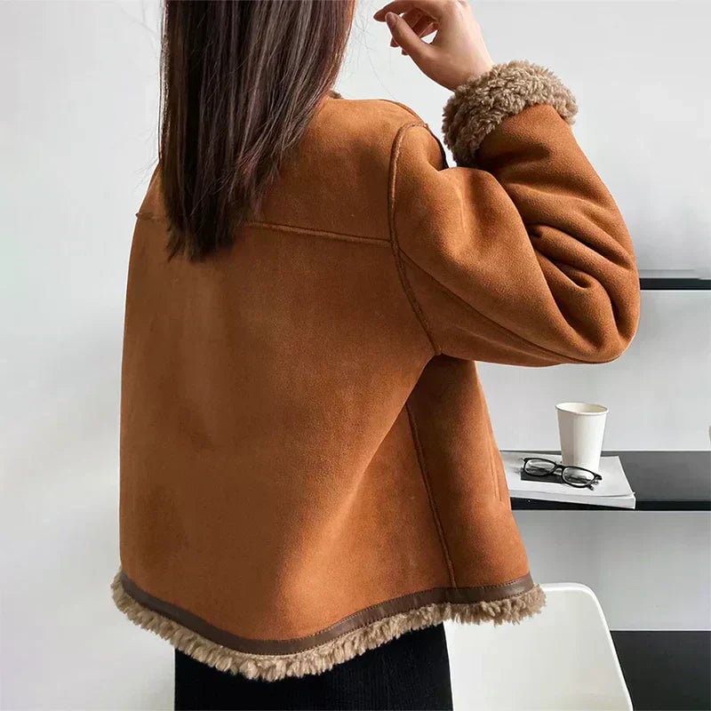 Side profile of the brown Audrey jacket highlighting its flattering structured cut