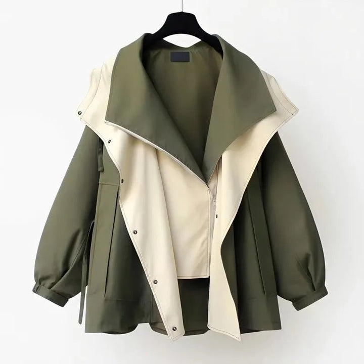 Detail view of the Aurelia windbreaker jacket showing zipper, elastic cuffs, and button closures