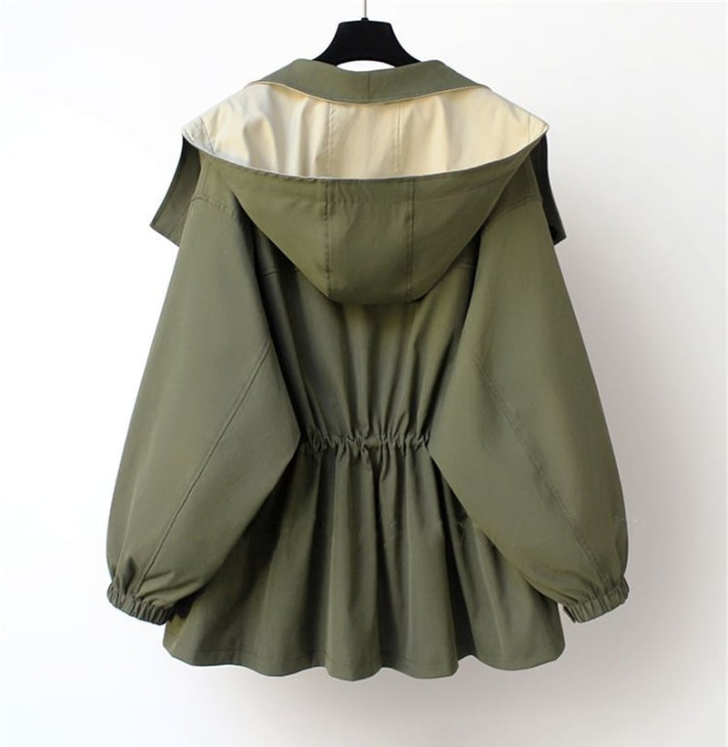Side profile of the Aurelia windbreaker jacket highlighting the flattering drawstring waist